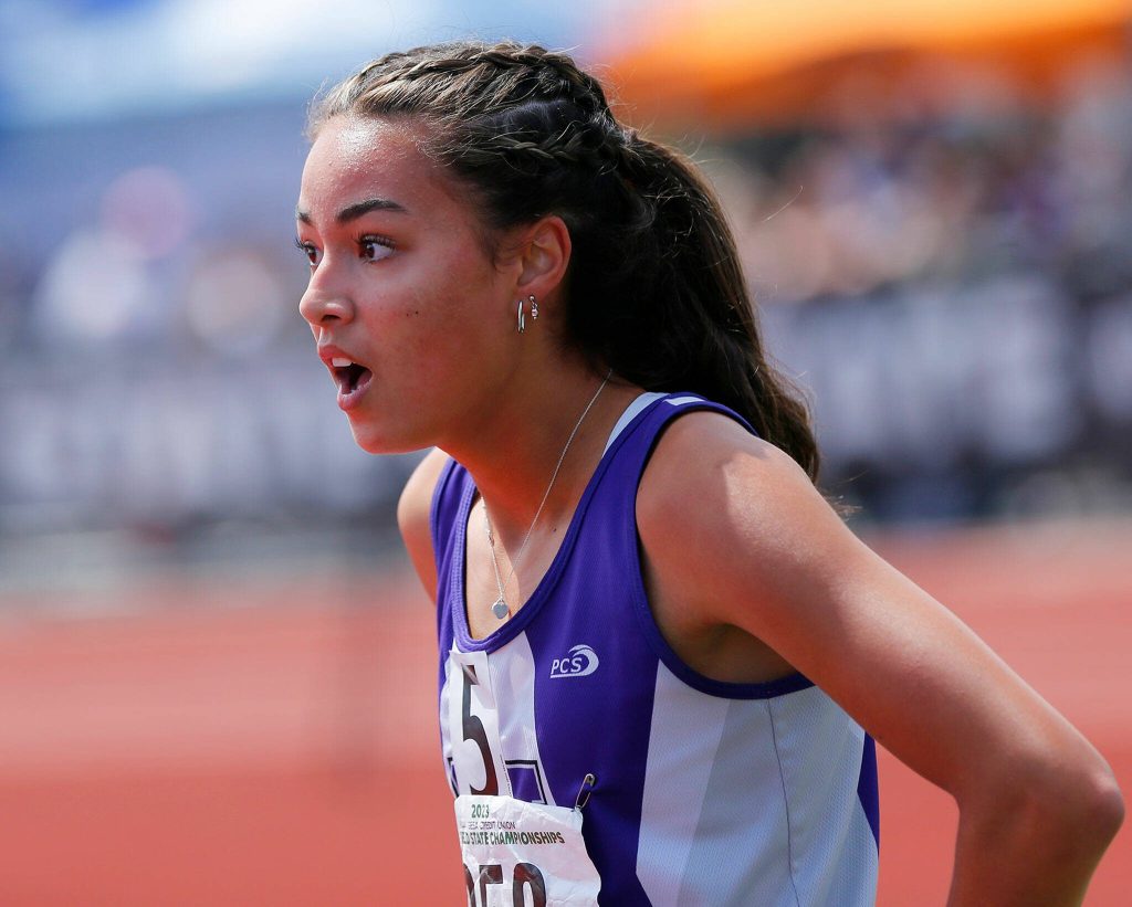 Kamiaks Kalia Estes looks around in disbelief after winning the 4A girls 300 meter hurdles by one-hundredth of a second during the WIAA State Track and Field Championships on Saturday, May 27, 2023, at Mount Tahoma High School in Tacoma, Washington. (Ryan Berry / The Herald)