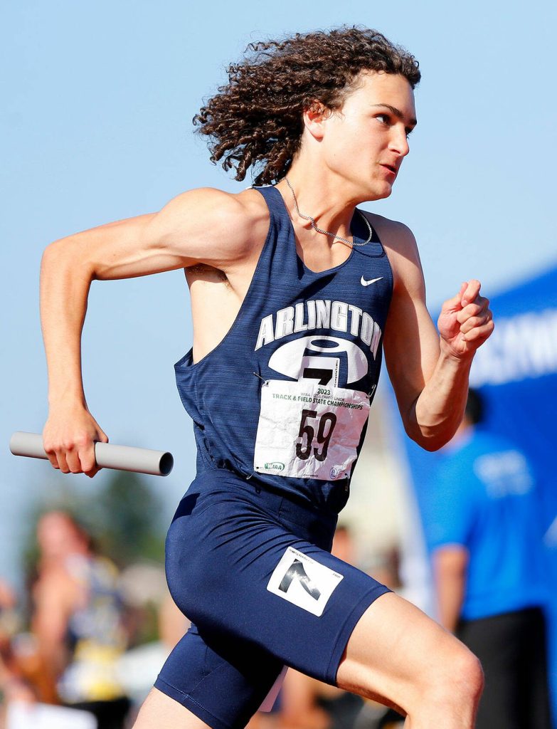 Arlington senior Kellen Langford begins the final leg of the 3A boys 4x400 meter relay during the WIAA State Track and Field Championships on Saturday, May 27, 2023, at Mount Tahoma High School in Tacoma, Washington. (Ryan Berry / The Herald)