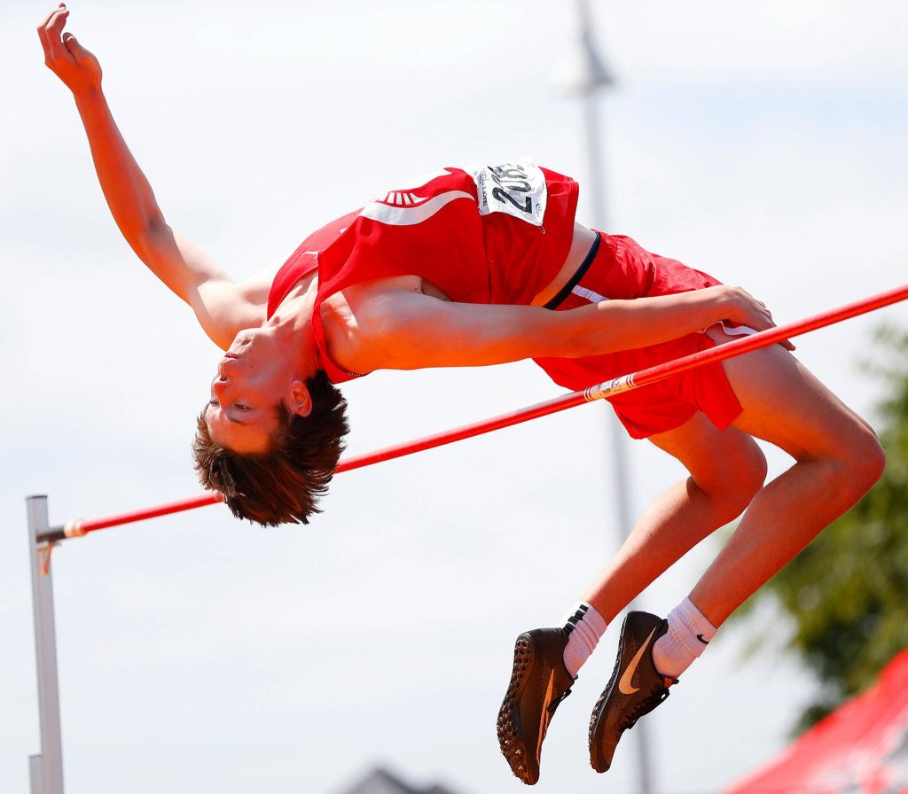 Stanwood sophomore Elias Caniglia, having already won state in the 3A boys high jump, tries for a 6-foot 7-inch jump during the WIAA State Track and Field Championships on Saturday, May 27, 2023, at Mount Tahoma High School in Tacoma, Washington. (Ryan Berry / The Herald)