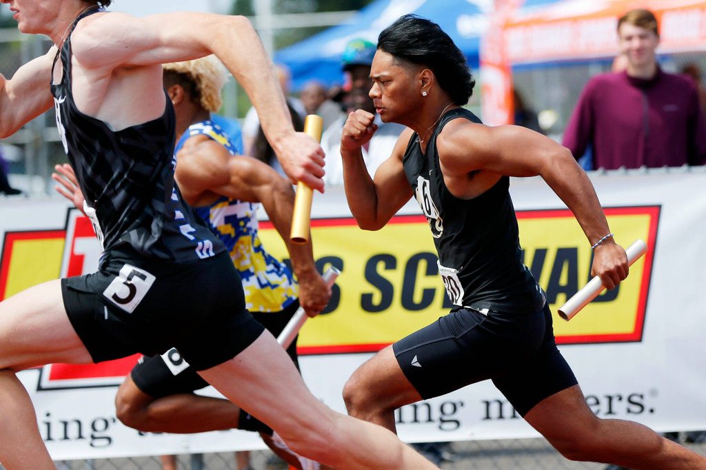 Lynnwoods Shayden McIntyre anchors the boys 3A 4x100 relay during the WIAA State Track and Field Championships on Saturday, May 27, 2023, at Mount Tahoma High School in Tacoma, Washington. (Ryan Berry / The Herald)