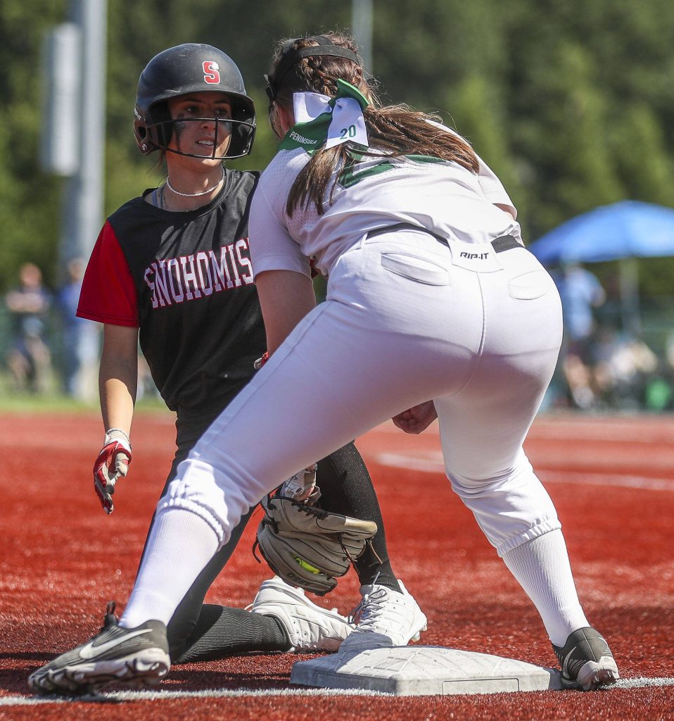 A Snohomish player slides safe into third during the 3A softball championship game between Snohomish and Peninsula at the Lacey-Thurston County Regional Athletic Complex in Olympia, Washington on Saturday, May 27, 2023. Snohomish lost, 4-1. (Annie Barker / The Herald)