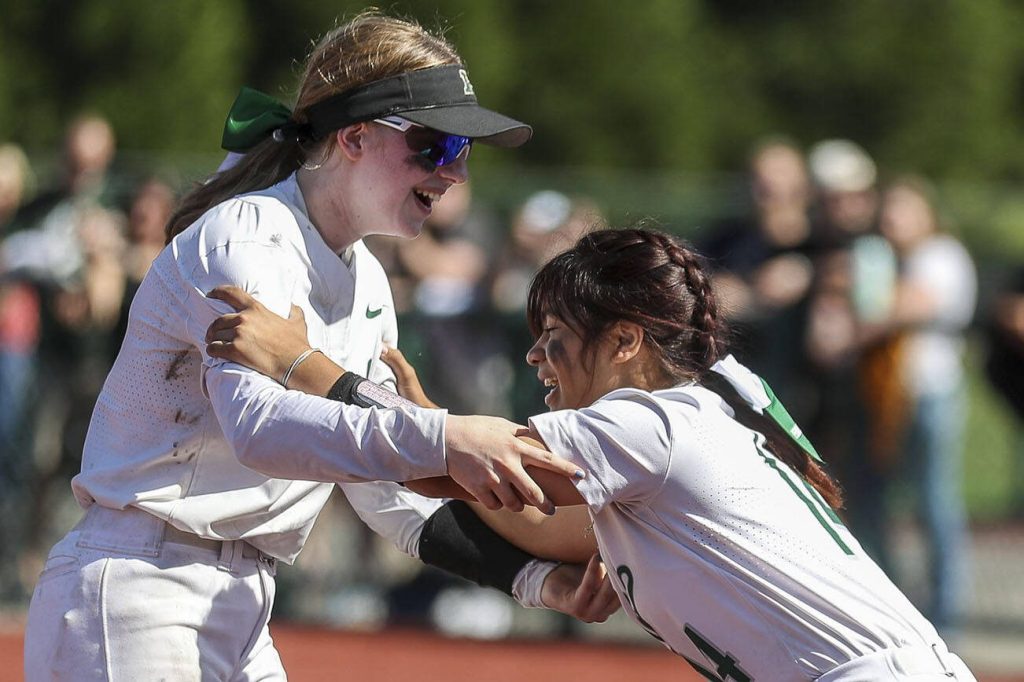 Peninsula players celebrate during the 3A softball championship game between Snohomish and Peninsula at the Lacey-Thurston County Regional Athletic Complex in Olympia, Washington on Saturday, May 27, 2023. Snohomish lost, 4-1. (Annie Barker / The Herald)