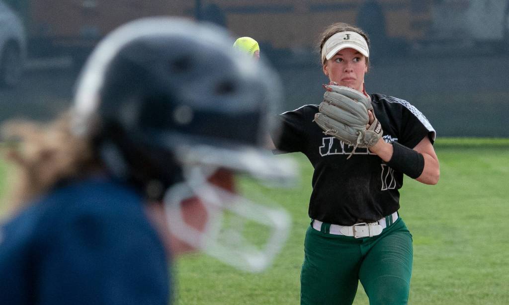 Jacksons Rachel Sysum (11) throws the ball to first base for an out during the WIAA Class 4A state softball title game on Saturday, May 27, 2023, in Richland. (TJ Mullinax / For The Herald)