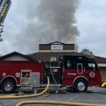Smoke comes out of the roof of ReMyx'd, a restaurant on Smokey Point Drive, on Sunday, May 28, 2023, in Arlington, WA. (IAFF Local 3438)