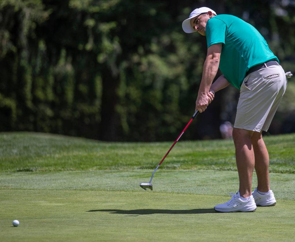 Joel Micka putts during the Snohomish County Amateur golf tournament at the Everett Golf and Country Club in Everett, Washington on Monday, May 29, 2023. (Annie Barker / The Herald)