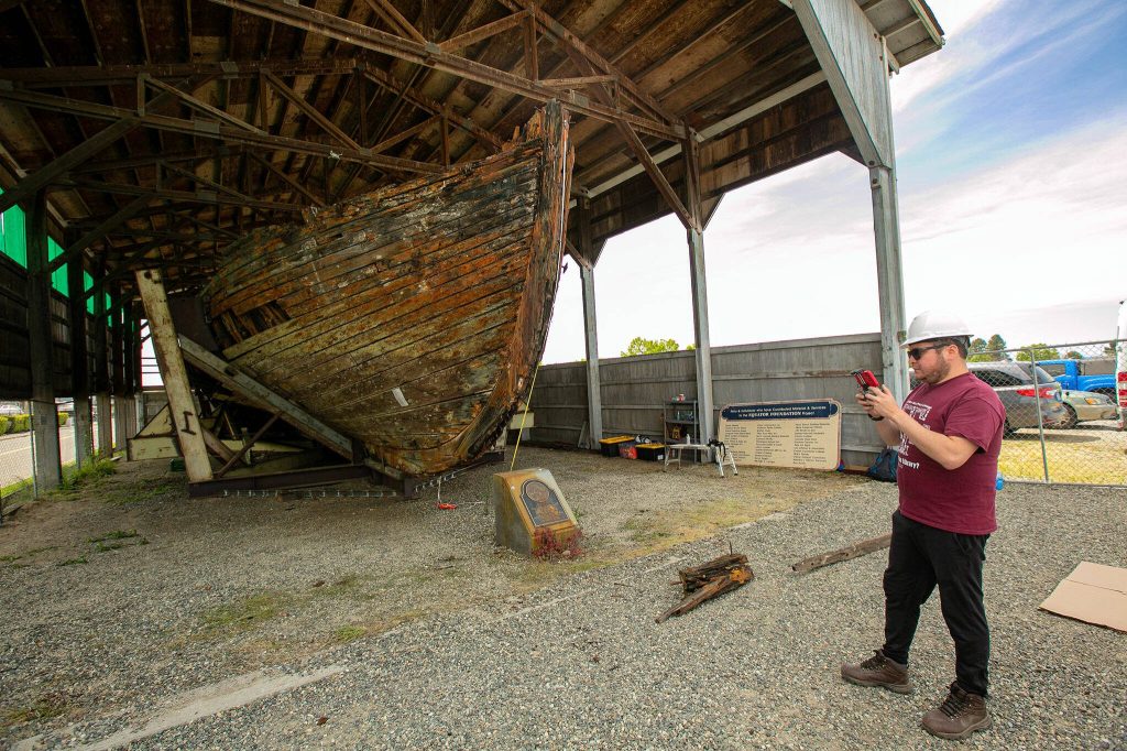 Texas A&M graduate student Raul Palomino flies a drone over the Equator to collect images of the top decks and the interior on Wednesday, June 7, 2023, during a two-week survey of the vessel at its resting place in Everett, Washington. (Ryan Berry / The Herald)