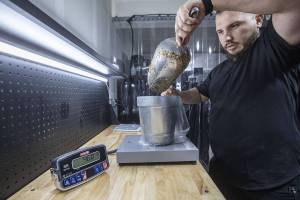 Nathanael Engen prepares the mixture to cultivate mushrooms at his property in Everett, Washington on Monday, March 27, 2023. Engen summarizes his business as “cultivating mushrooms, and healthy communities”. (Annie Barker / The Herald)