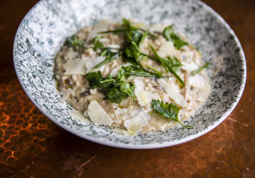 <strong></strong>Fire and the Feasts mushroom risotto entree on Tuesday, April 4, 2023 in Edmonds, Washington. (Olivia Vanni / The Herald)