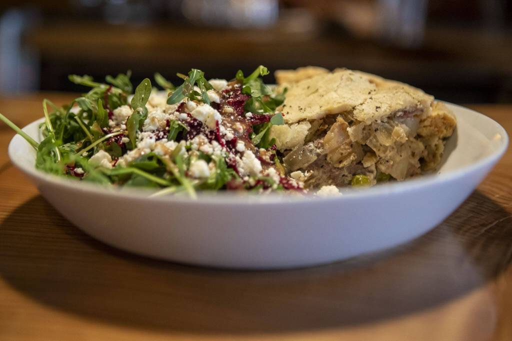 The steak pot pie and salad at Pie Dive Bar. (Annie Barker / The Herald)