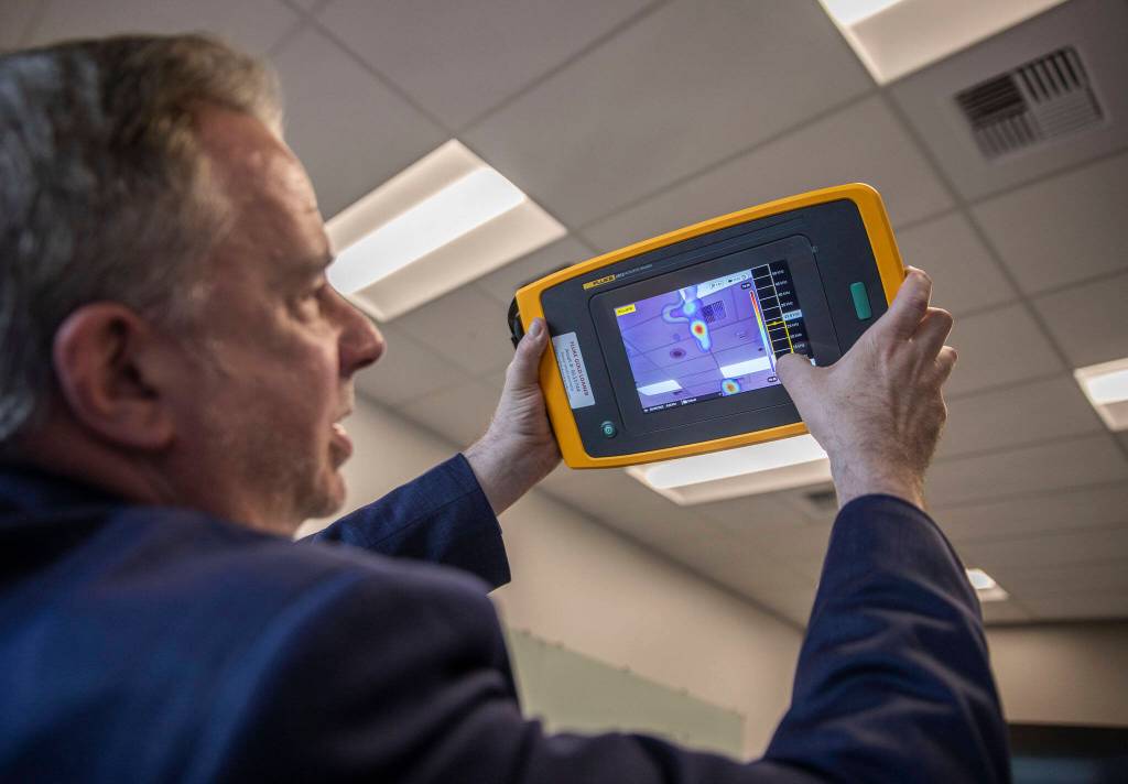 Fluke Corp. President Jason Waxman shows how to use one of Flukes new thermal measuring tools on May 9, 2023 in Everett, Washington. (Olivia Vanni / The Herald)