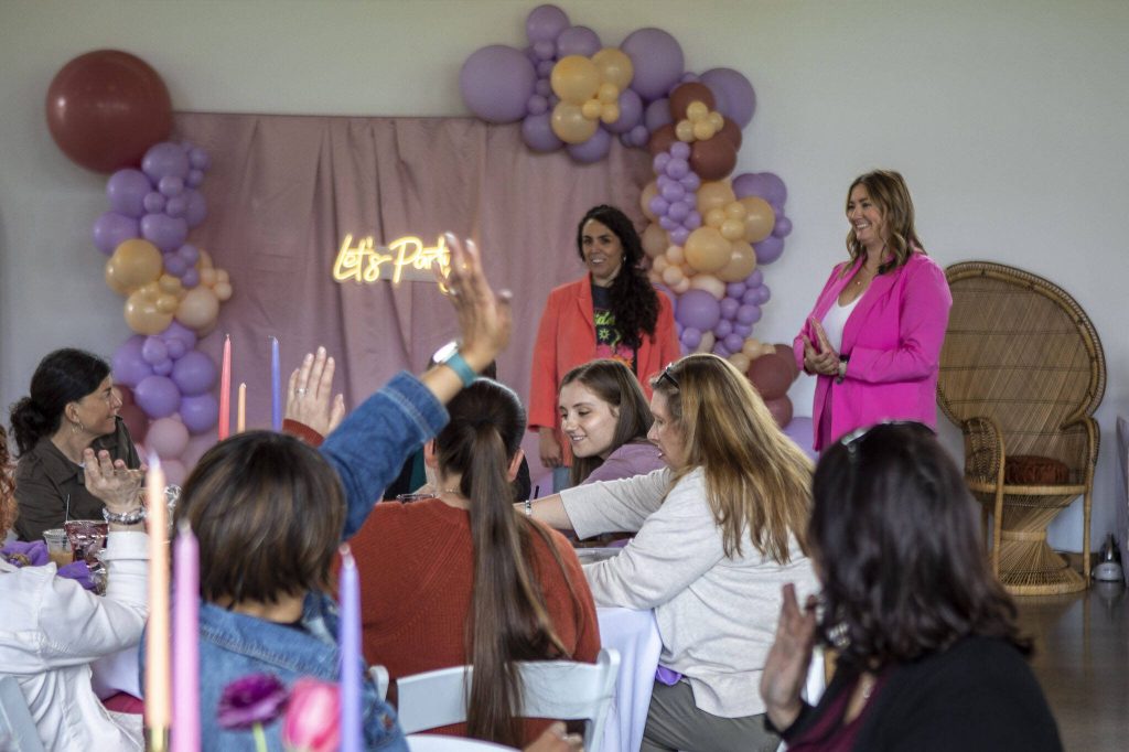 Mallori Rojas, left, and Rachel Daniels, right, ask who has made a charcuterie board before during a Charcuterie 101 Workshop at Machias Meadows in Snohomish, Washington on Sunday, May 7, 2023. (Annie Barker / The Herald)