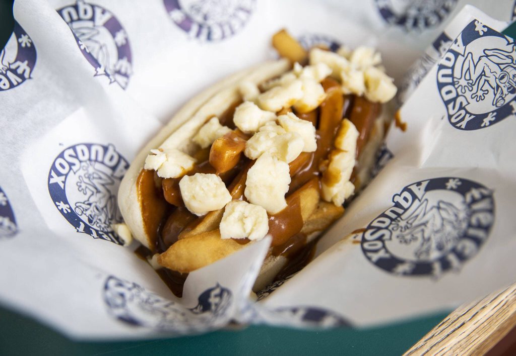 The Vancouver Canadians Poutine Dog is made with Beechers cheese curds, french fries and brown gravy. (Olivia Vanni / The Herald)