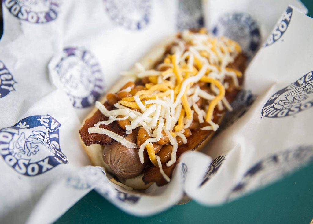 The Eugene Emeralds Sasquatch Bacon Dog is made with bacon, baked beans, shredded cheese and barbecue sauce. (Olivia Vanni / The Herald)