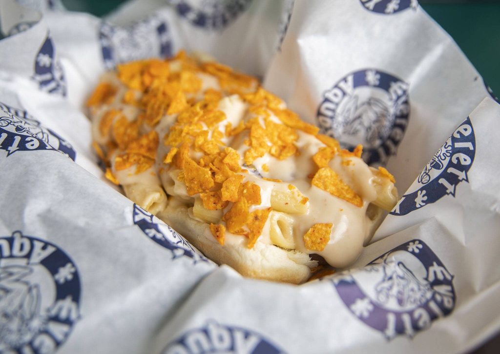The Hillsboro Hops Cheesy Mac & Cheese Dog is made with Beechers mac and cheese, nacho cheese and crushed nacho cheese Doritos. (Olivia Vanni / The Herald)