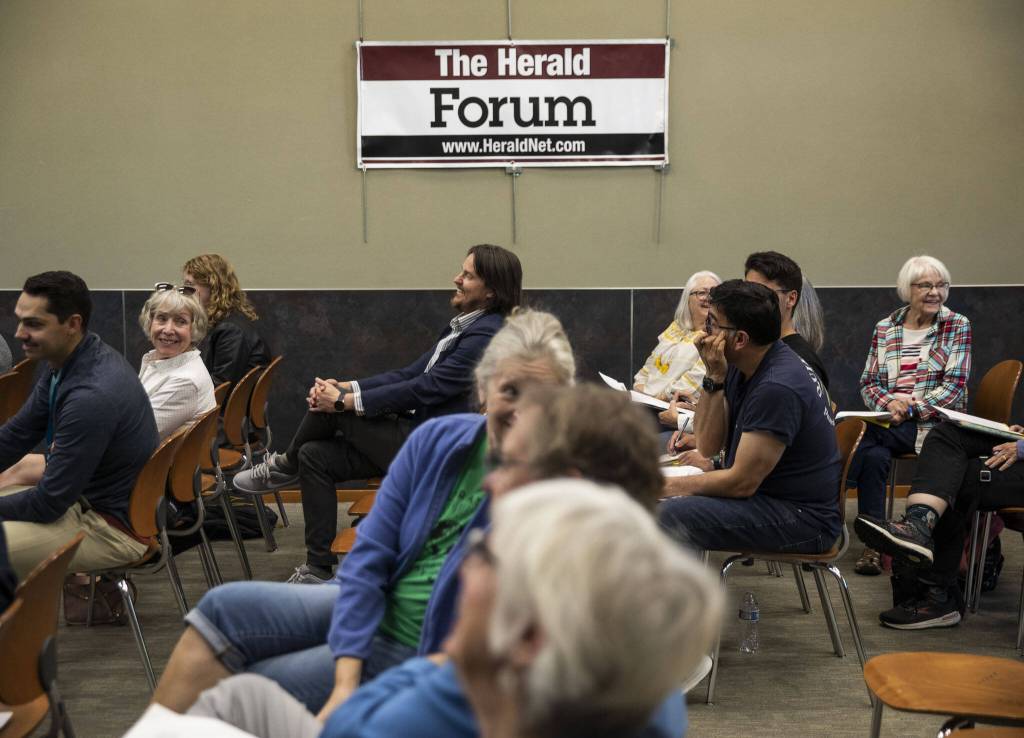 Audience members laugh during the Herald Forum about mental health care on Wednesday, May 31, 2023 in Snohomish, Washington. (Olivia Vanni / The Herald)