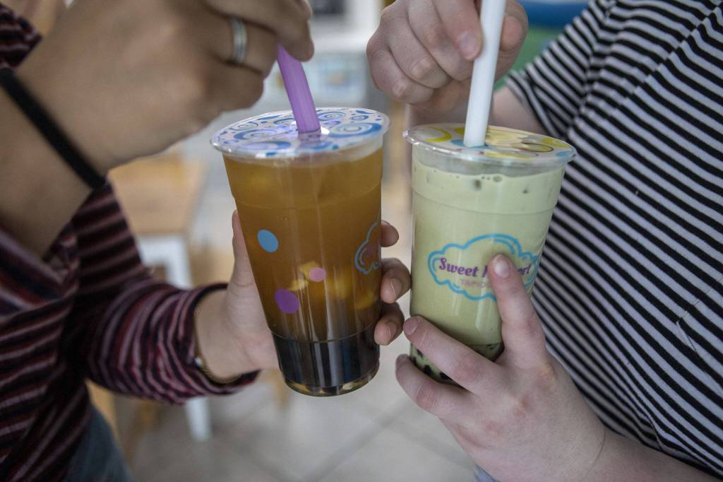 Cups of mango green tea, left, and matcha, right, at Sweet N Short Tapioca Tea in Everett, Washington on Tuesday, May 30, 2023. (Annie Barker / The Herald)