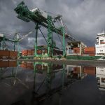 The 214-foot tall cranes work to unload their first cargo shipments at South Terminal at the Port of Everett on Thursday, April 8, 2021 in Everett, Washington. (Olivia Vanni / The Herald)