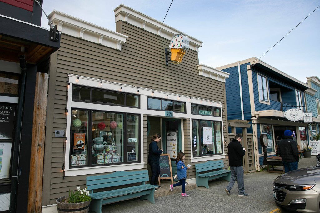 Customers depart from Sprinklz Ice Cream Parlor and Coffee Shop on Wednesday, April 5, 2023, in Langley, Washington. (Ryan Berry / The Herald)
