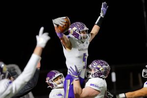Lake Stevens’ Cole Becker celebrates a touchdown with teammates after putting his team up against Kennedy Catholic in the WIAA 4A State Football Championship game Saturday, Dec. 3, 2022, at Mount Tahoma Stadium in Tacoma, Washington. (Ryan Berry / The Herald)