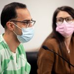 Hussein Ali, alongside attorney Laura Shaver, speaks to Judge Joseph P. Wilson during his sentencing Tuesday, Feb. 1, 2022, at the Snohomish County Superior Courthouse in Everett, Washington. (Ryan Berry / The Herald)