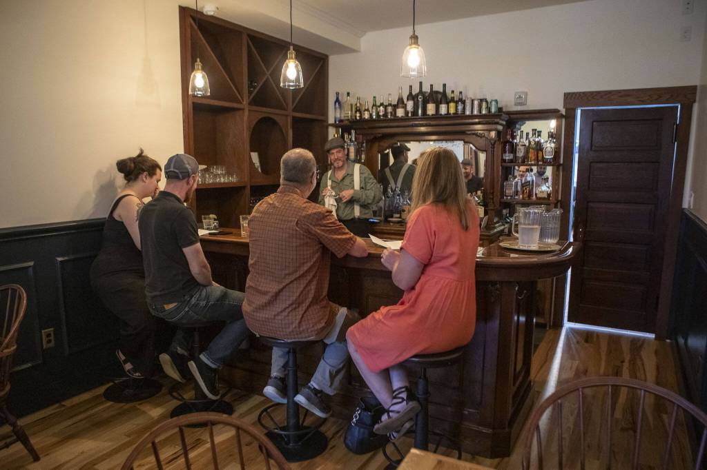 A bar area where patrons can order drinks plus food off the main menu at the Bush House Inn in Index, Washington on Monday, June 26, 2023. (Annie Barker / The Herald)