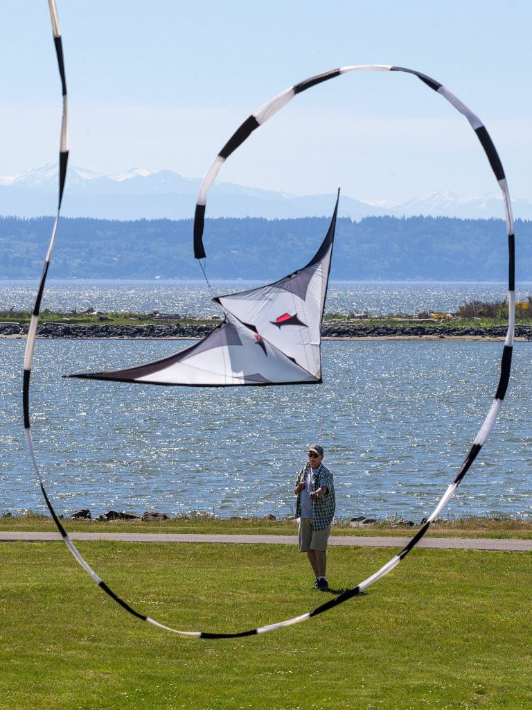 Jim Dygert, of Lynnwood, turns loops his dual line stunt kite at  Boxcar Park on Monday, May 22, 2017 in Everett, Wa. "It's the ultimate (for kites), you'd have to go to the coast for a better place to fly," he says.(Andy Bronson / The Herald)