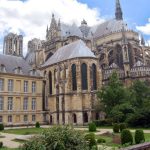 A glorious example of Gothic architecture, Reims Cathedrals construction began in 1211. Around the back of the church, flying buttresses are hard at work, supporting the massive structure. (Rick Steves Europe)