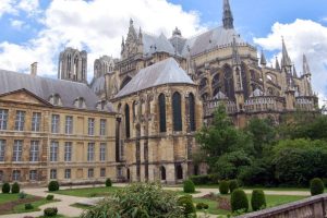 A glorious example of Gothic architecture, Reims Cathedral's construction began in 1211. Around the back of the church, flying buttresses are hard at work, supporting the massive structure.