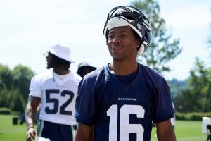 Seattle Seahawks wide receiver Tyler Lockett (16) and Seattle Seahawks linebacker Darrell Taylor (52) walk off the field after an NFL football practice, Wednesday, June 7, 2023, team's facilities in Renton, Wash. (AP Photo/John Froschauer)