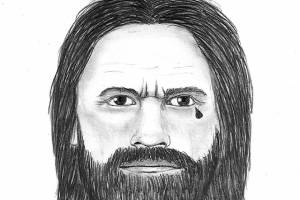 A sketch of the suspect in an assault and burglary in Marysville is described as a white man between 40 and 50 years old with brown eyes and longer brown or dark-colored hair. He is between 5 feet 1 inch and less than 6 feet tall with an average build.  The suspect also has a full beard and a tattoo of a teardrop at the corner of his left eye. (Marysville Police Department)