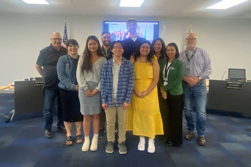 Back row, from left, Larry Brown, Co-Chair, Workforce Training and Education Coordinating Board; Shannon Tarrach, Director of College and Career Readiness, Monroe High School. Front row of students, from left, Boramy Sam, Calvin Cha and Amor Ayala Luna. (Photo credit Monroe School District)