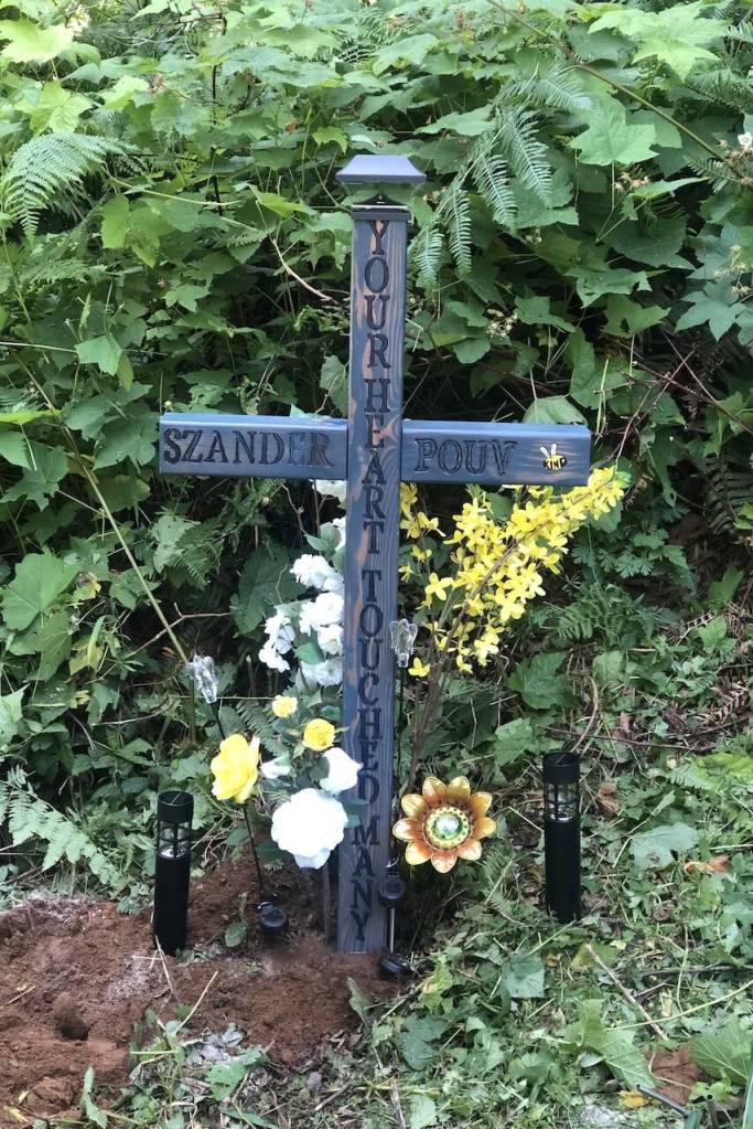 The new cross marking the site of a car crash that lead to the death of Szander Pouv. The original cross recently went missing. (Photo provided by Haylee Munger)