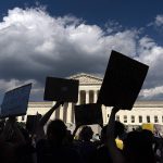FILE - Abortion-rights activists protest outside the Supreme Court in Washington, Saturday, June 25, 2022. The Supreme Court's ruling allowing states to regulate abortion has set off a mad travel scramble across the country to direct patients to states that still allow the procedure. (AP Photo/Jose Luis Magana, File)