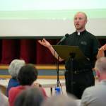 Joseph Altenhofen, priest at Our Lady of Hope Catholic Church, speaks to Riverside neighbors at the beginning of a public meeting about a proposed homeless day shelter at the churchs unused parish hall Thursday, June 29, 2023, in Everett, Washington. (Ryan Berry / The Herald)