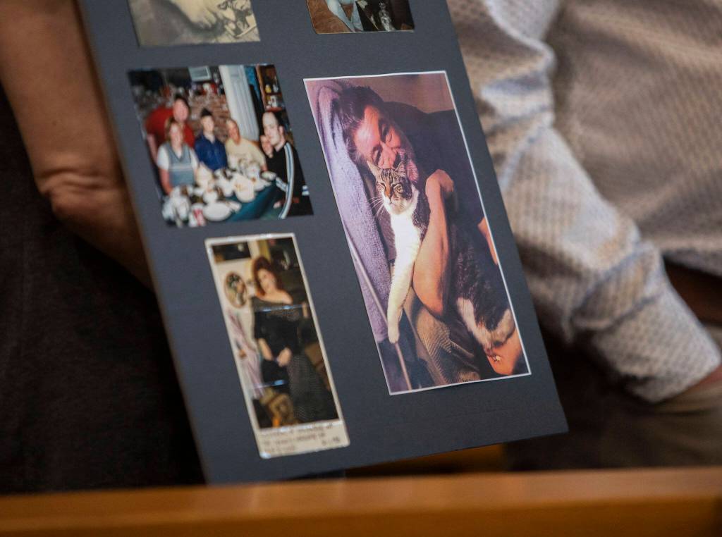 A poster board with pictures of Greg McKnight is held up for display during Baylors sentencing at the Snohomish County Courthouse on Monday, June 26, 2023 in Everett, Washington. (Olivia Vanni / The Herald)