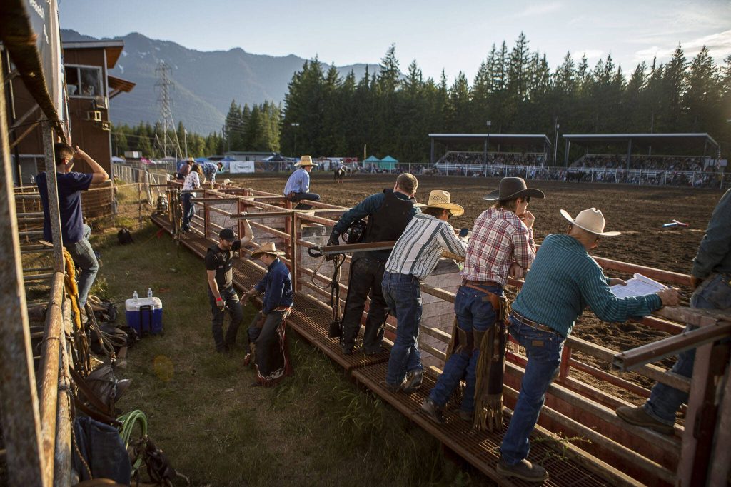Participants wait for the next section of competition during the Timberbowl Rodeo in Darrington, Washington on Saturday, June 24, 2023. (Annie Barker / The Herald)
