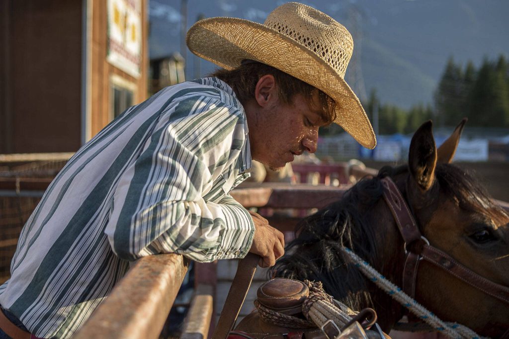 Kadyn Wilson, 20, prepares a horse for ranch saddle bronc riding during the Timberbowl Rodeo in Darrington, Washington on Saturday, June 24, 2023. (Annie Barker / The Herald)