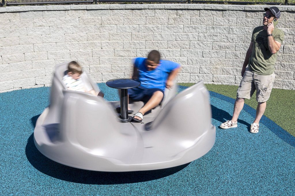 Children play at the Hazel Miller Universally Accessible Playground at Ballinger Park in Mountlake Terrace, Washington on Wednesday, June 28, 2023. (Annie Barker / The Herald)