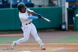 AquaSox catcher Harry Ford hits a fly ball during a game against the Vancouver Canadians on Thursday, June 8, 2023, at Funko Field in Everett, Washington. (Ryan Berry / The Herald)