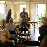 John Lovie, director of the Whidbey Island Water Systems Association, speaks to around 20 residents  mainly from the Harrington Lagoon neighborhood  during a public meeting regarding PFAS found in the drinking water of multiple Island County communities on June 22, 2023, at the Coupeville Recreation Hall in Coupeville, Washington. (Ryan Berry / The Herald)