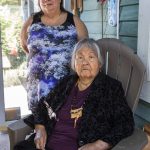 Tribal elders Ronda Metcalf, left, and Norma Joseph pose for a photo outside of Joseph sisters home on the Sauk-Suiattle Reservation on Tuesday, June 6, 2023 in Darrington, Washington. (Olivia Vanni / The Herald)