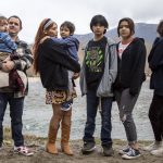 Shawn Haggard and Khrista Bill, at left, stand with their children near the Sauk-Suiattle Reservation in Darrington, Washington on Thursday, March 23, 2023. (Annie Barker / The Herald)