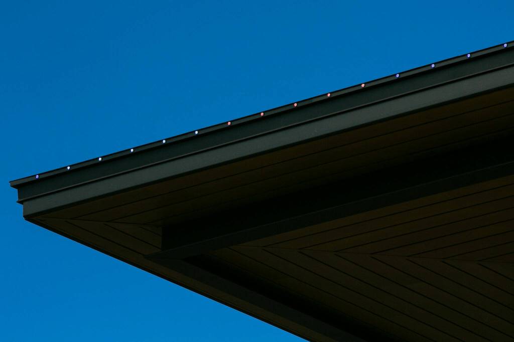 Newly installed LED trim lights glow red, white and blue atop the Marysville Civic Center on Friday, June 30, 2023, in Marysville, Washington. (Ryan Berry / The Herald)