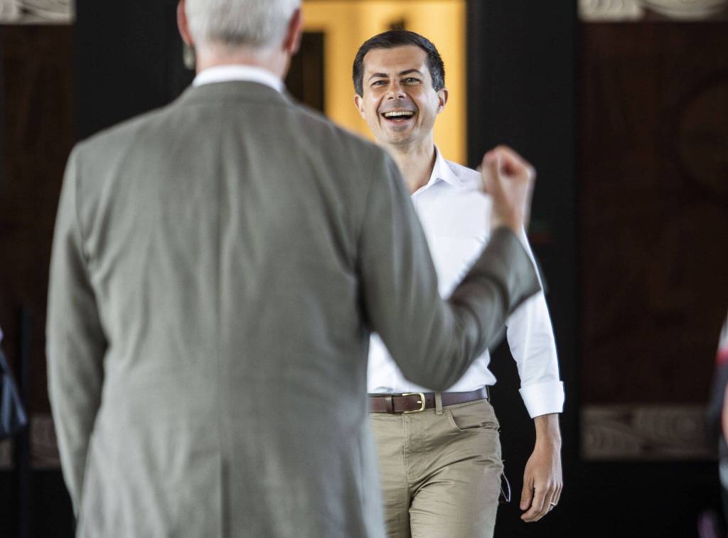 U.S. Transportation Secretary Pete Buttigieg smiles while he is greeted by U.S. Representative Rick Larsen before the start of his tour of Mukilteo Ferry Terminal on Thursday, July 6, 2023 in Mukilteo, Washington. (Olivia Vanni / The Herald)
