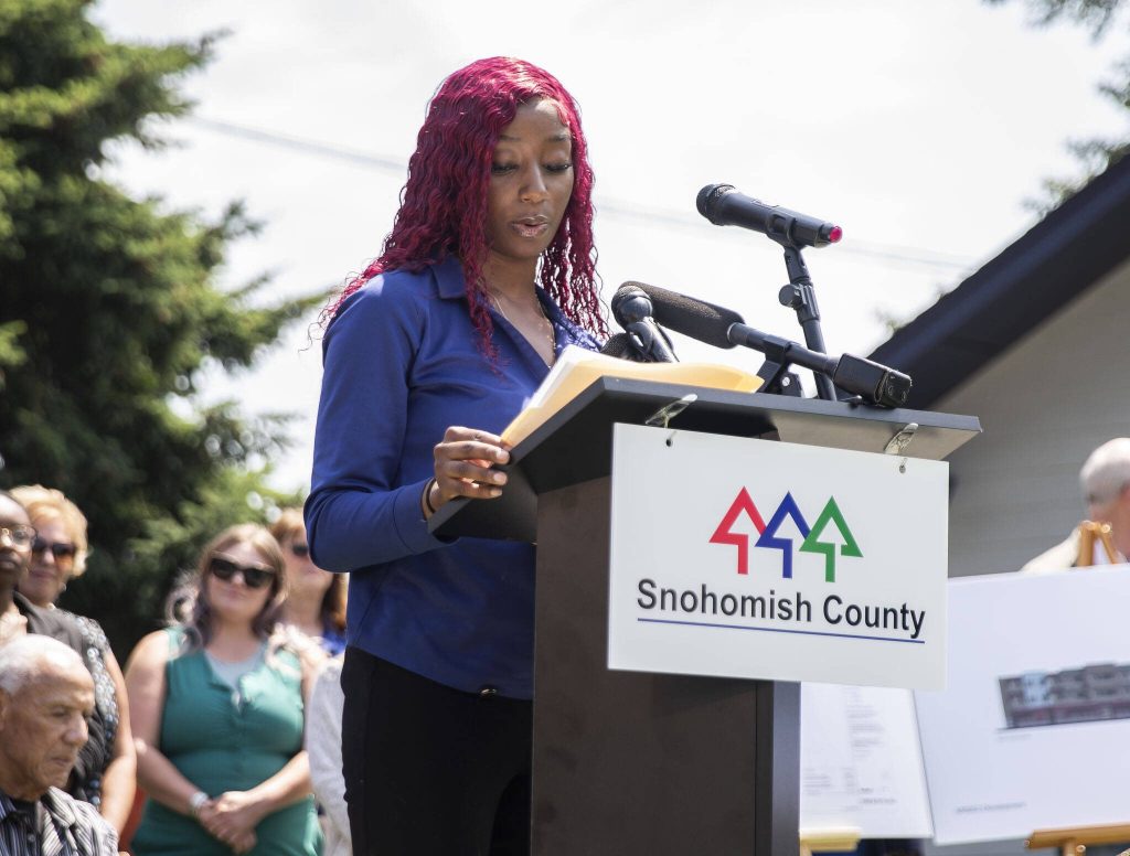 Former Rise Up Academy students Mariame Toure speaks about her time at the school and how it helped her late on in life during an event announcing funding for affordable child care slots held at Rise Up Academy on Thursday, July 6, 2023 in Everett, Washington. (Olivia Vanni / The Herald)