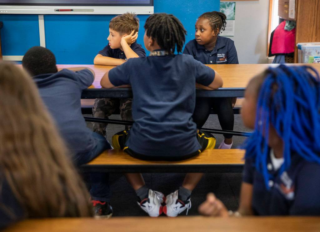 Rise Up Academy students listen while their teachers give them activity instructions on Thursday, July 6, 2023 in Everett, Washington. (Olivia Vanni / The Herald)