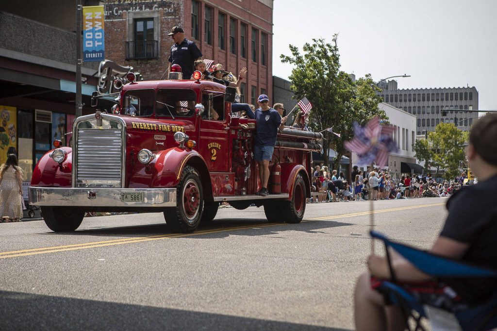 An Everett Fire Department truck drives during the Everett 4th of July parade in downtown Everett, Washington on Tuesday, July 4, 2023. (Annie Barker / The Herald)