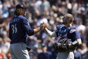 Seattle Mariners starting pitcher Logan Gilbert (36) and catcher Tom Murphy celebrate Gilbert's five-hitter against the San Francisco Giants in a baseball game, Tuesday, July 4, 2023, in San Francisco. The Mariners won 6-0. (AP Photo/D. Ross Cameron)