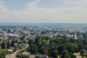 Boats navigate their way across Possession Sound through a visible haze on Wednesday, July 5, 2023, in Everett, Washington. (Olivia Vanni / The Herald)