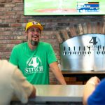 Matt Pereira, owner and brewer at 4 Stitch Brewing Company, talks with a couple regulars at the bar on Friday, June 23, 2023, in Mill Creek, Washington. (Ryan Berry / The Herald)